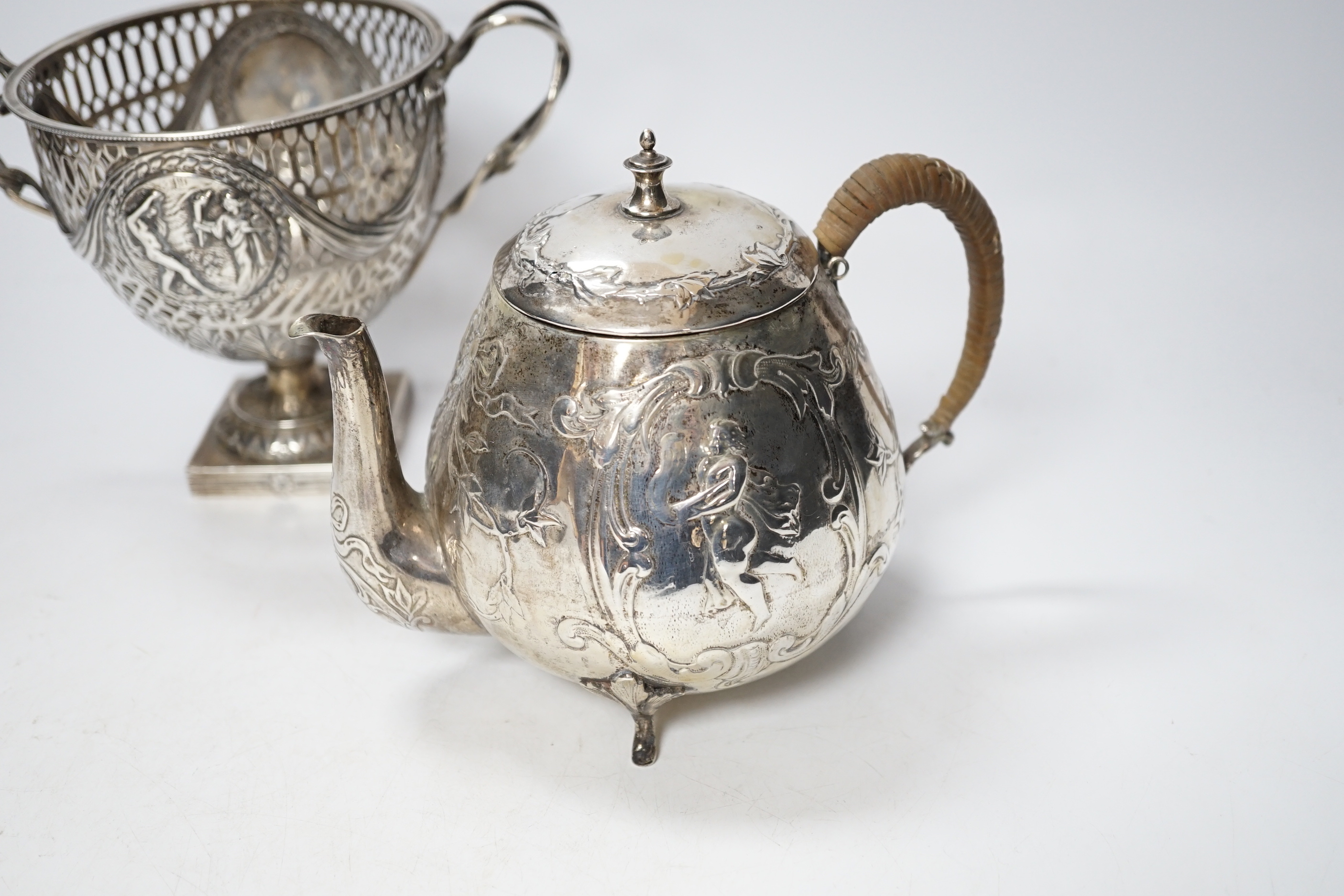 A pair of Thai circular white metal bowls, and a pair of small bowls, all decorated with animals and foliate scrolls, inscribed on bases, diameter 12cm and 8.5cm
